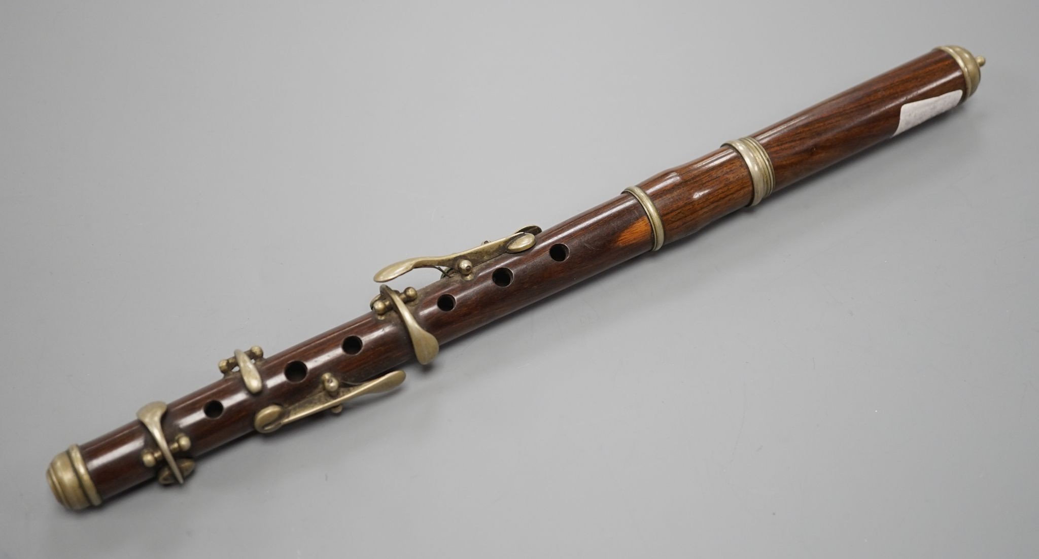 A rosewood piccolo, 32 cms long, stamped ‘for Keith Prowse Ltd. London’